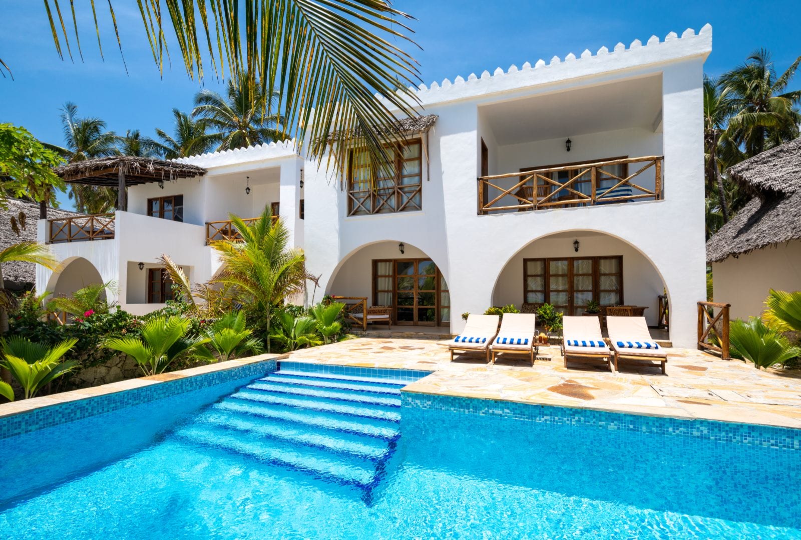 luxury Caribbean villa oasis which conveys elegance and the feeling of tropical living.